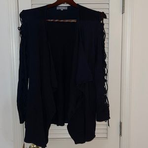 Black cardigan with open pattern on sleeve
